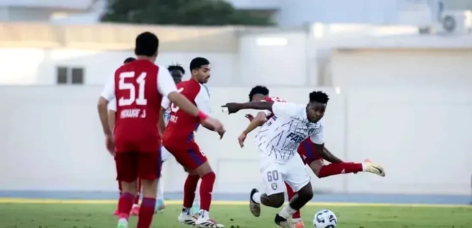 Al Dhafra U23 player dribbling past defenders