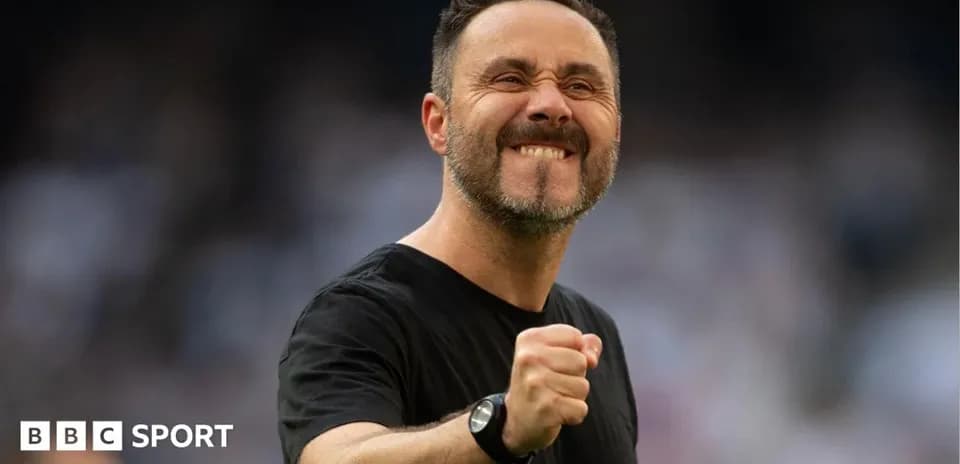 Coach celebrating with a clenched fist during match