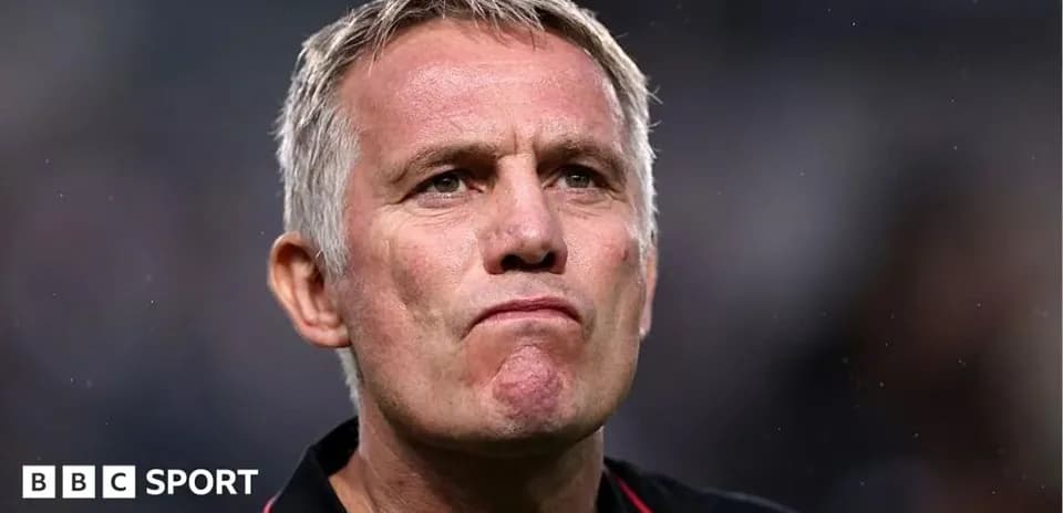 Manager with serious expression during match