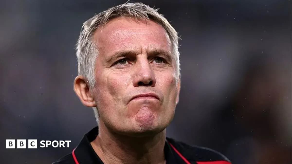 Manager with serious expression during match
