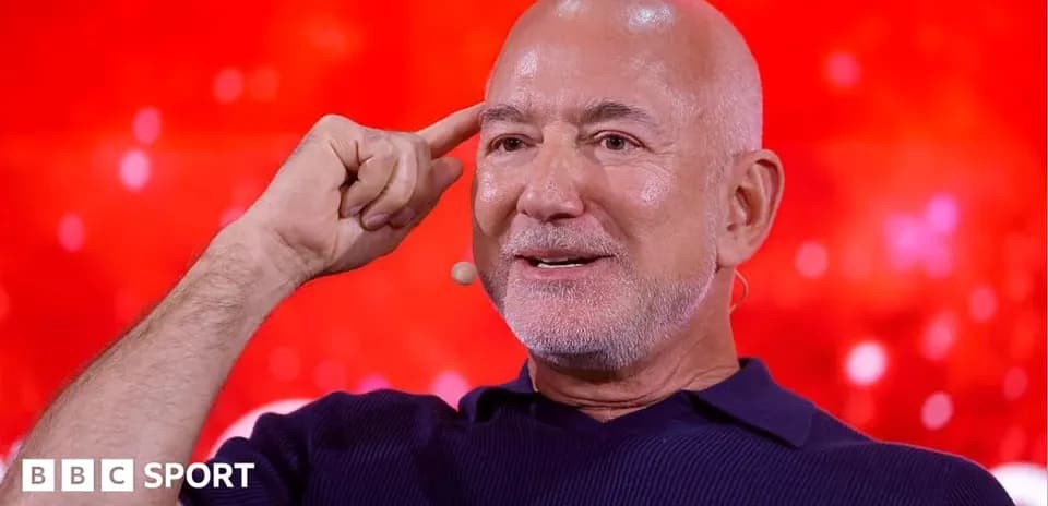 Speaker gesturing during a discussion on stage