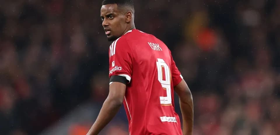 Player wearing red jersey with number 9 on pitch