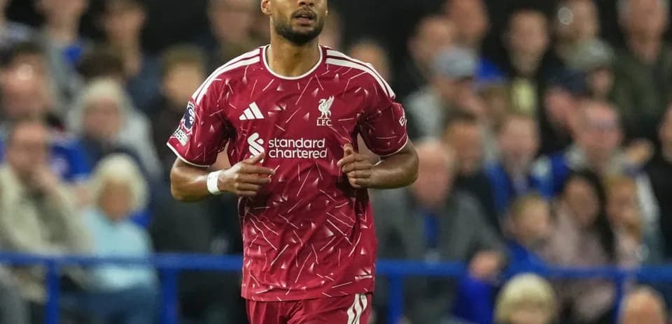 Liverpool player in red kit during match action