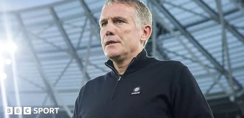 Manager speaking at stadium before match
