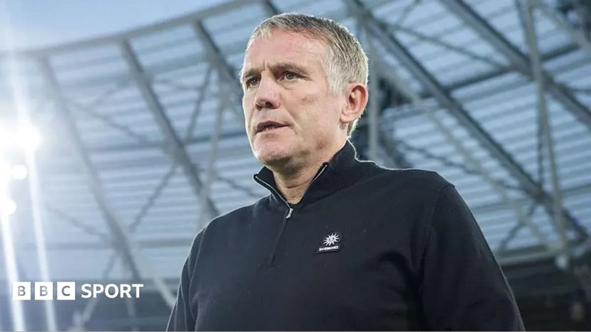 Manager speaking at stadium before match