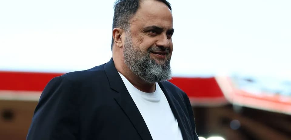 Man in black jacket smiling at event