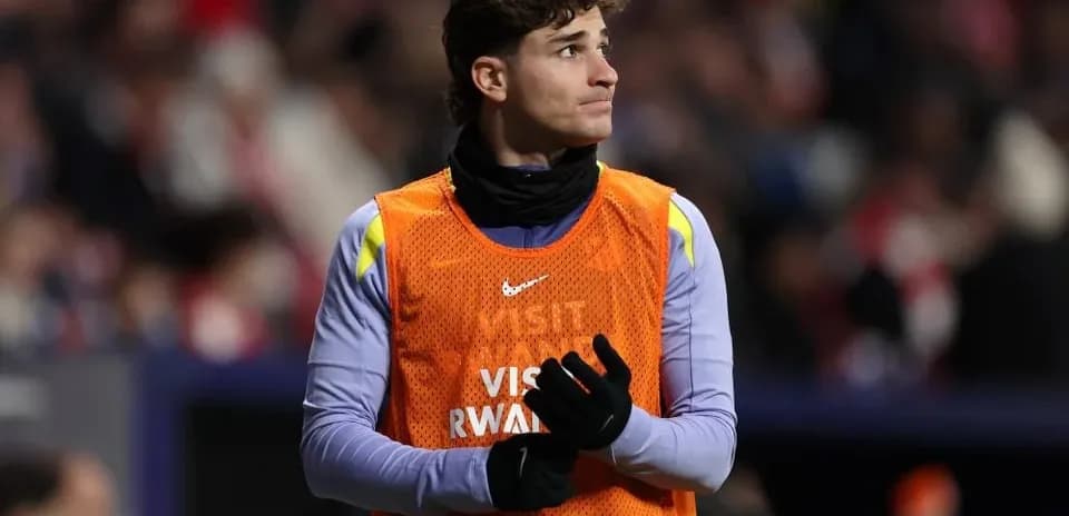 Player in warm-up gear on sidelines during match