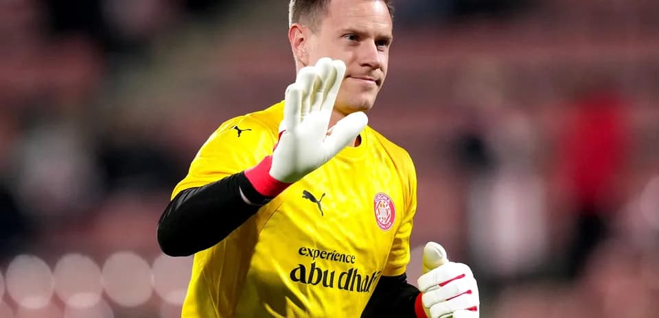Goalkeeper waving in yellow jersey during match