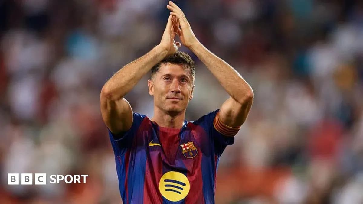 Player applauding fans during match at stadium