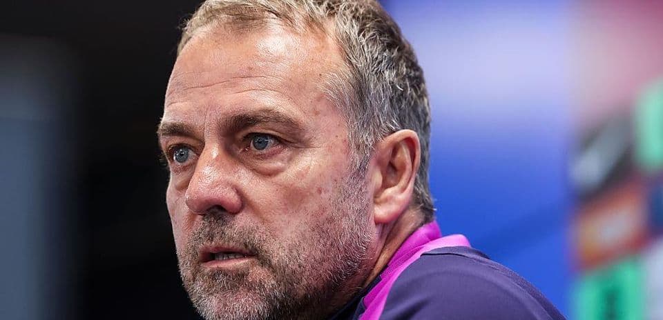 Manager speaking at press conference with serious expression