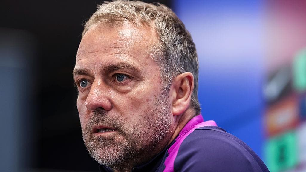 Manager speaking at press conference with serious expression
