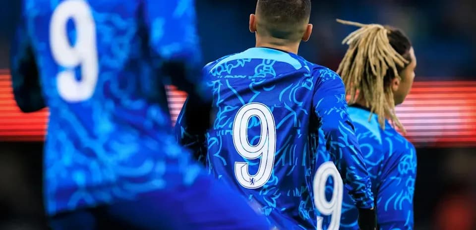 Players wearing blue jerseys with number 9 visible