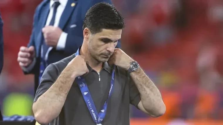 Coach adjusting his medal after the match