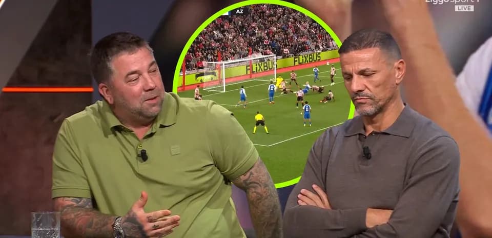 Two analysts discussing a football match on set