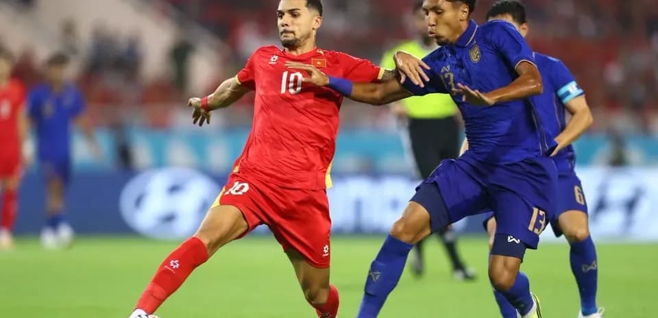 Two players contesting for the ball during match