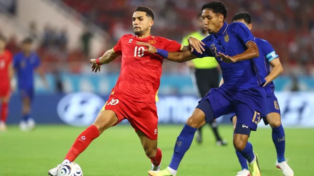Two players contesting for the ball during match