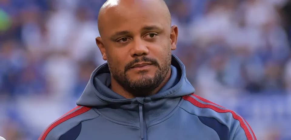 Coach in FC Bayern Munich tracksuit on field