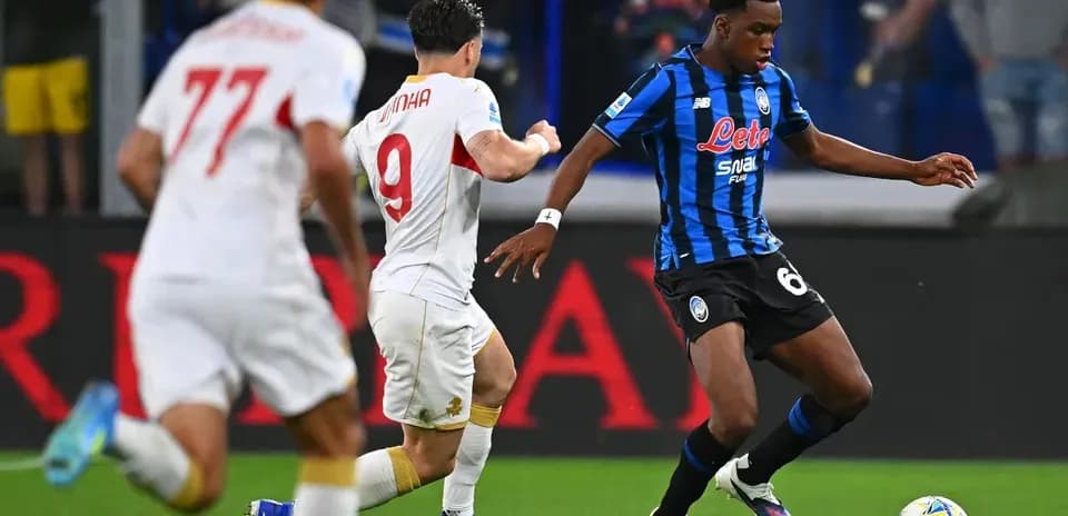 Player dribbling past opponent during match action