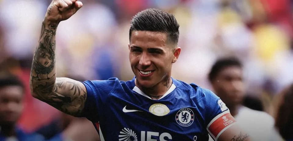 Player celebrating with raised fist in Chelsea jersey