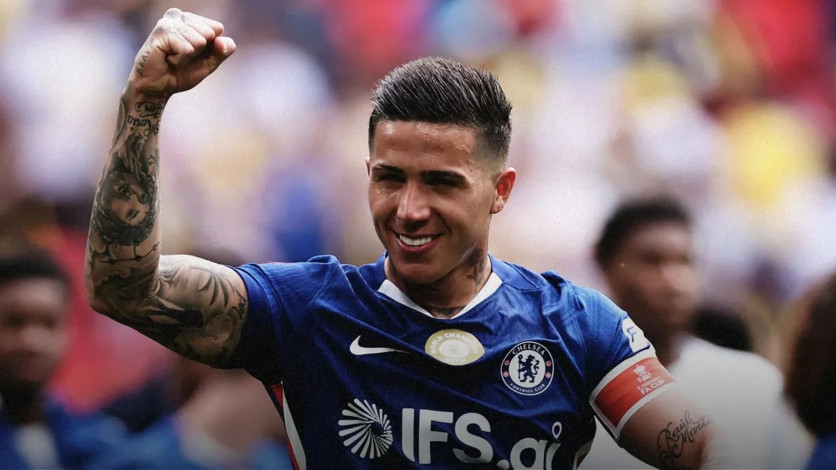 Player celebrating with raised fist in Chelsea jersey