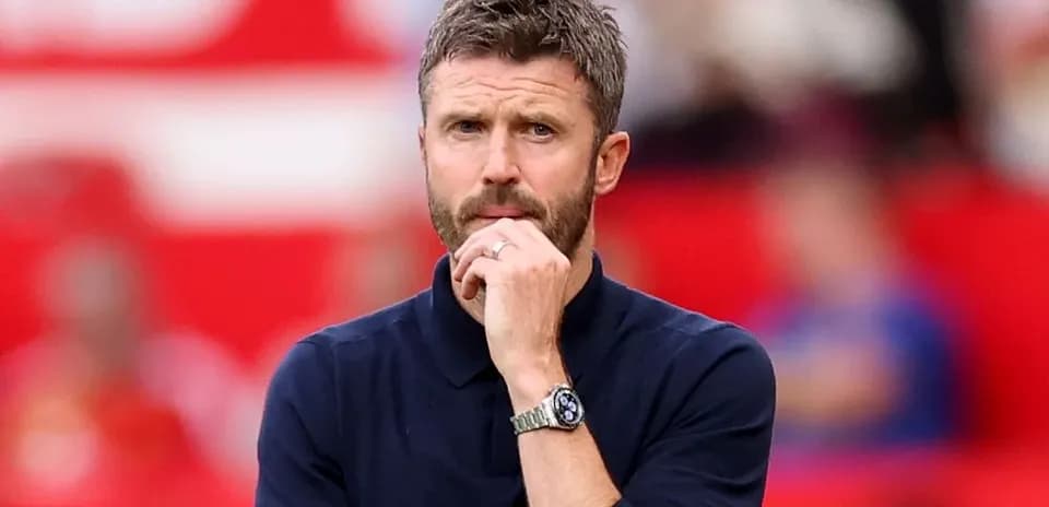 Coach observing match from the sidelines