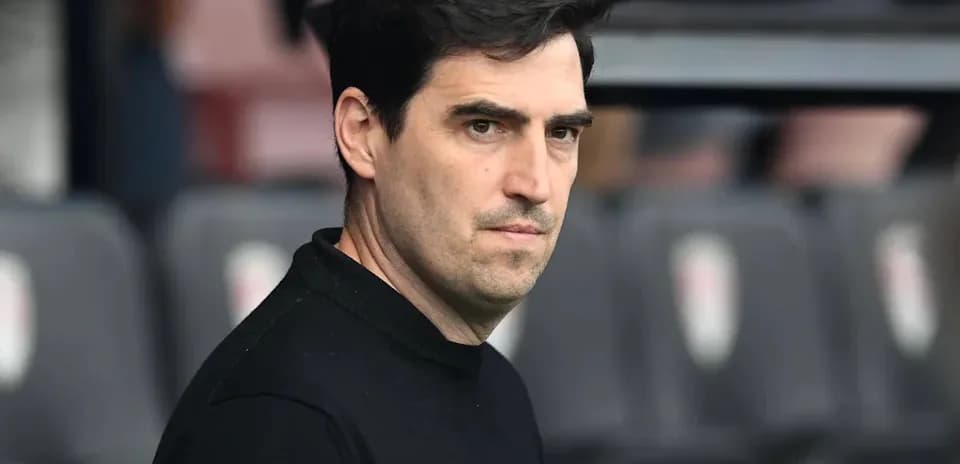 Coach observing the match from the sidelines