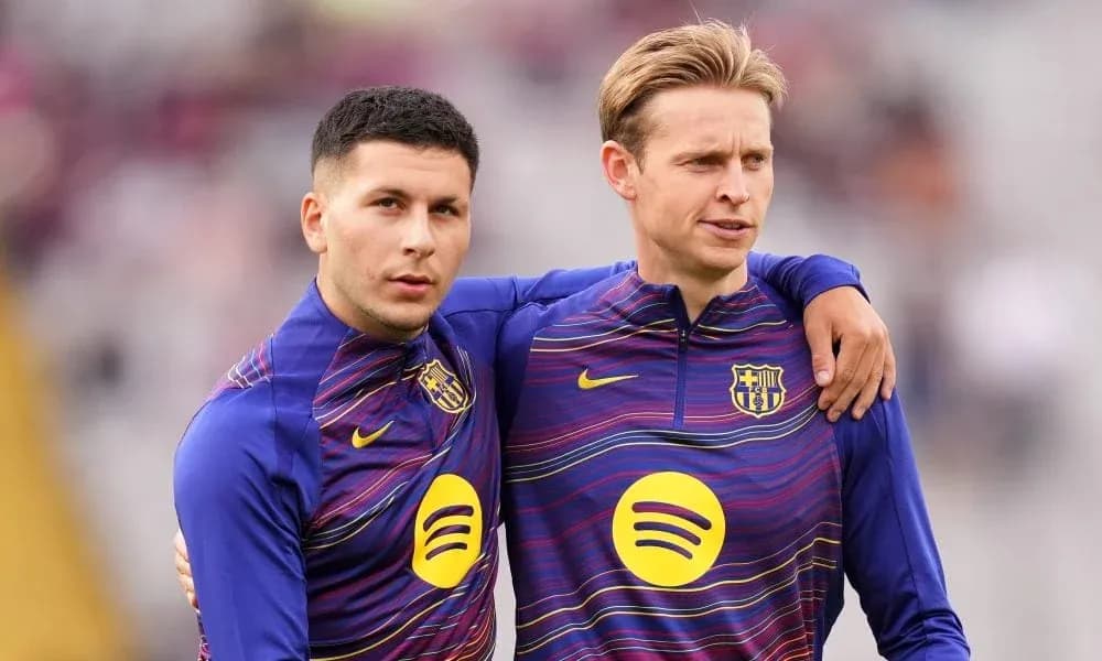 Two players in FC Barcelona training kits standing together