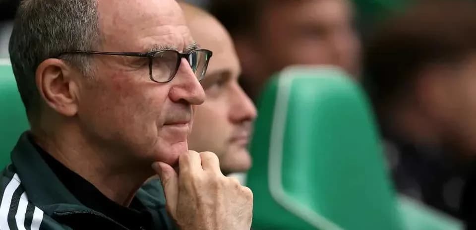 Coach observing match from the bench during game