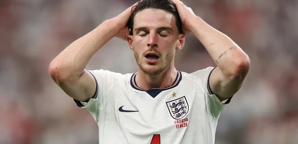 Player in England kit showing frustration on the field