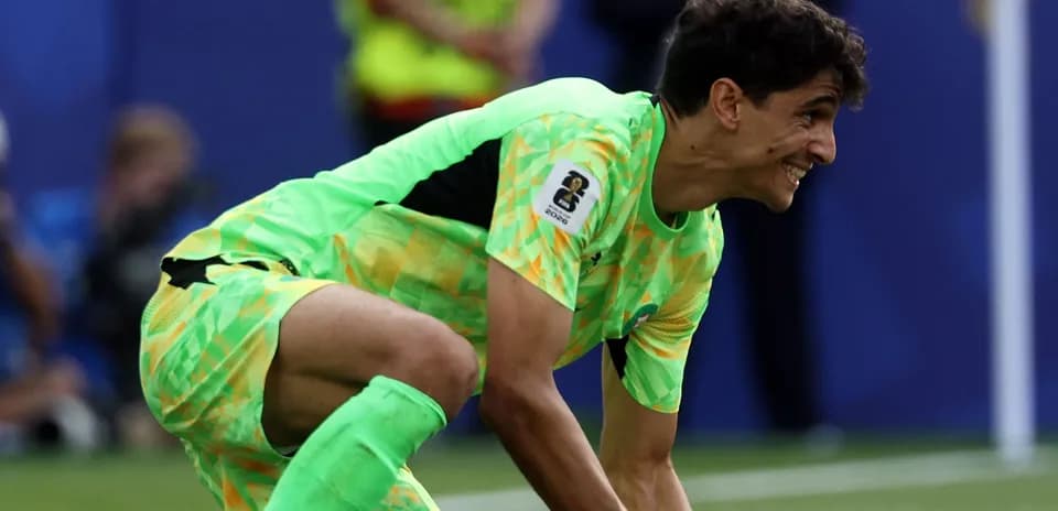 Goalkeeper in bright uniform preparing to play