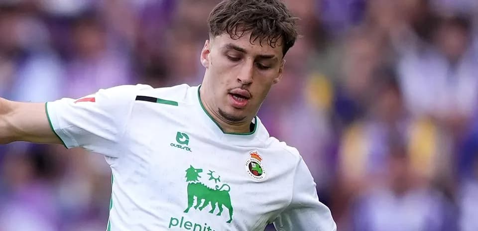 Player in white jersey dribbling during match