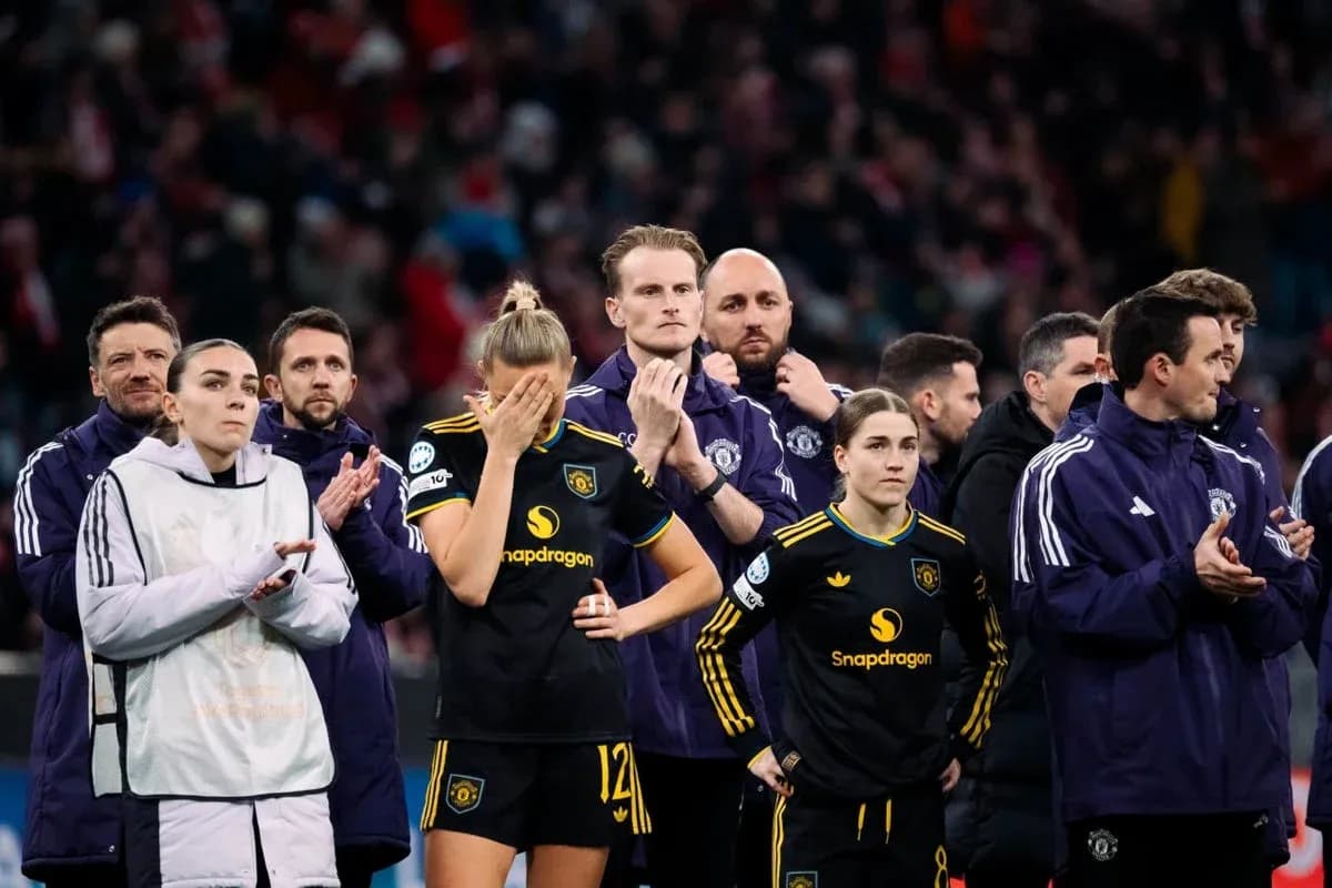 Players and staff standing together after match