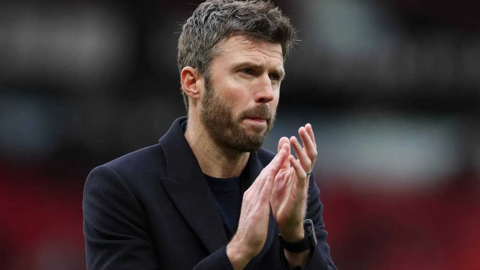 Coach applauding during a match or event Coach applauding during a match or event