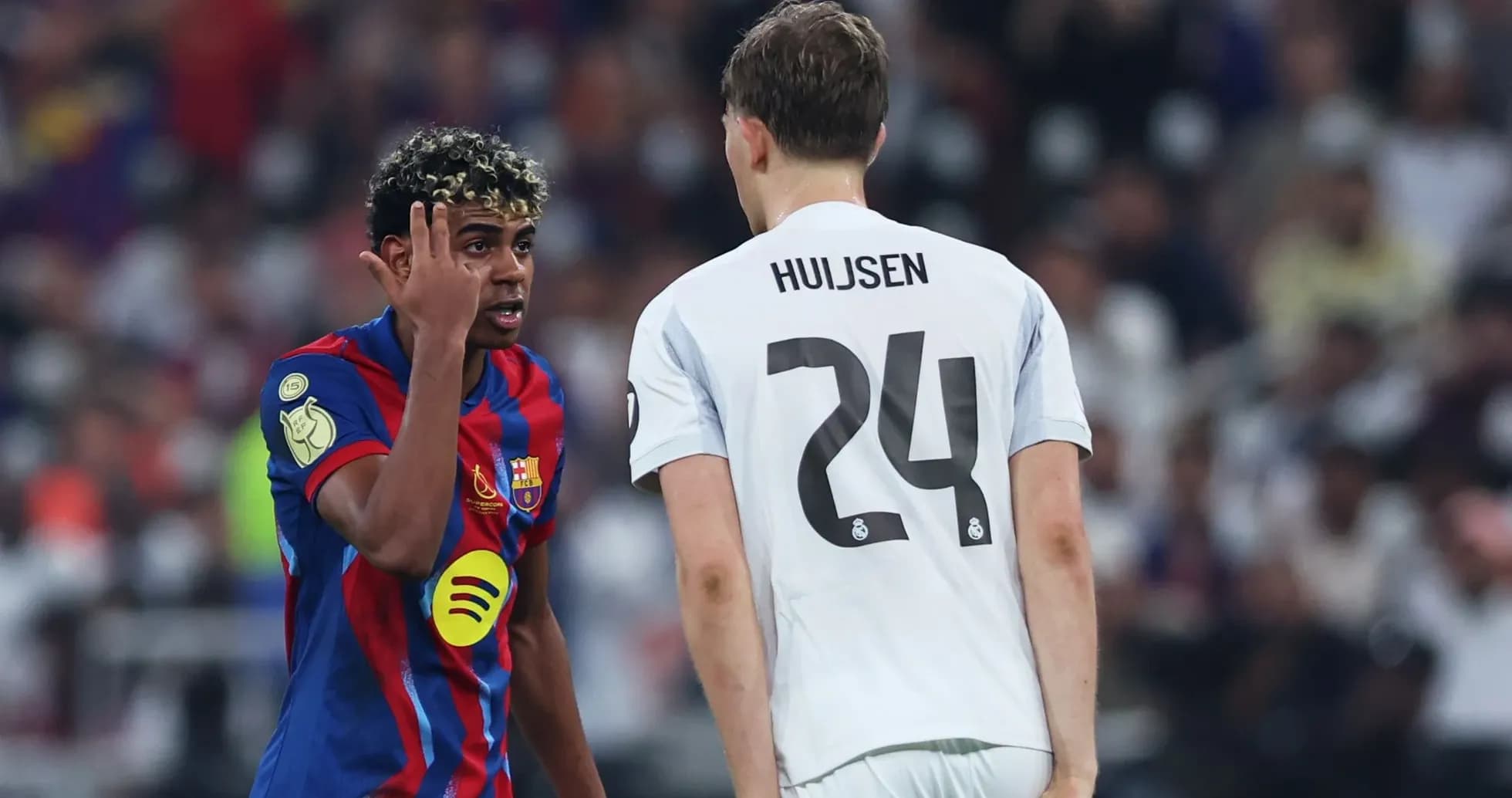 Barcelona player gesturing at Real Madrid opponent Barcelona player gesturing at Real Madrid opponent