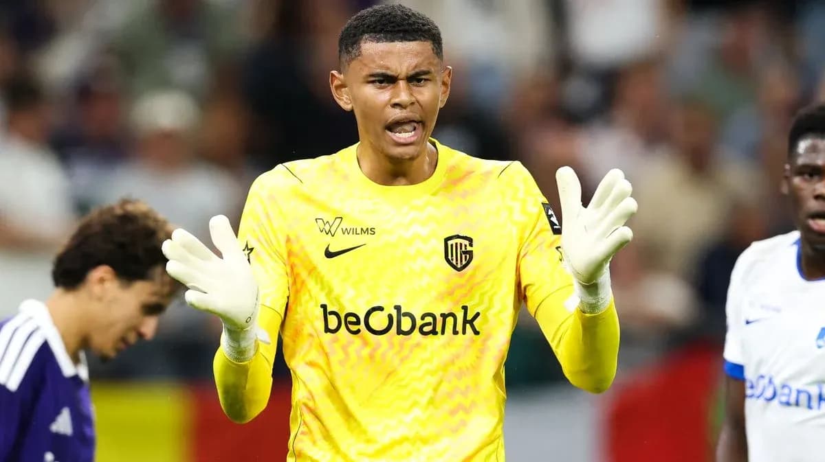Goalkeeper gesturing during a match in yellow uniform Goalkeeper gesturing during a match in yellow uniform