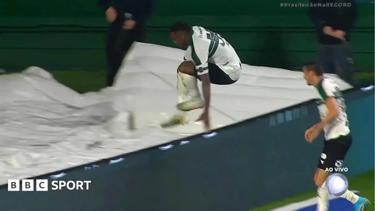 Player jumping over a tarp during the match Player jumping over a tarp during the match