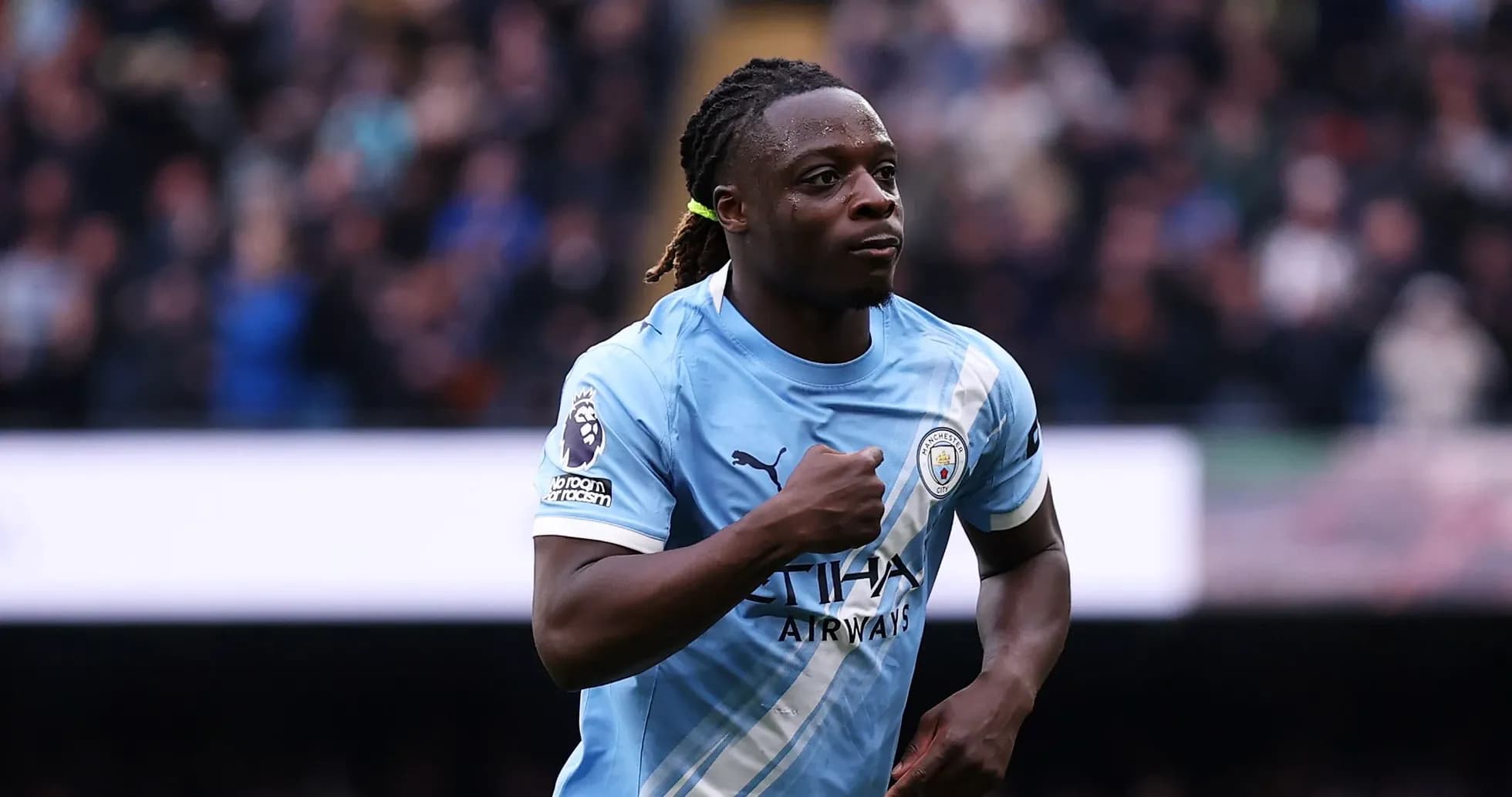 Player celebrating a goal in Manchester City kit Player celebrating a goal in Manchester City kit