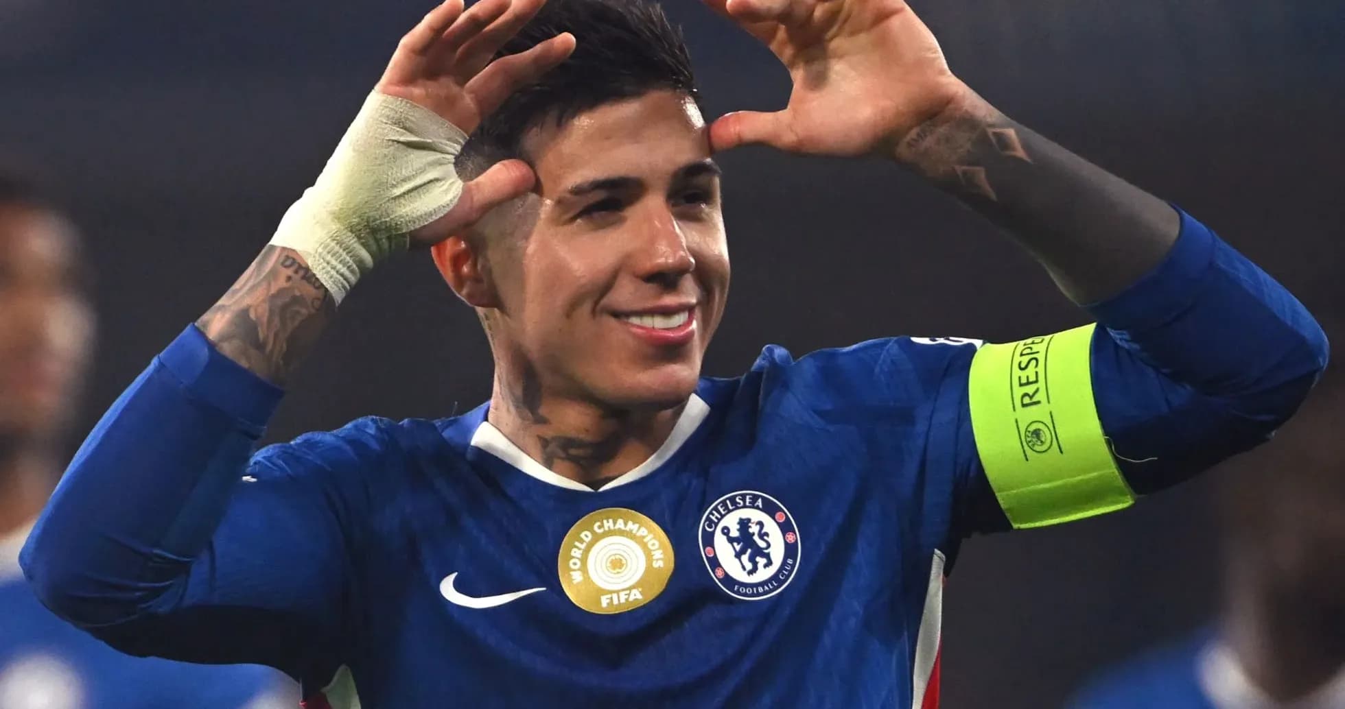 Chelsea player celebrating with hands raised Chelsea player celebrating with hands raised