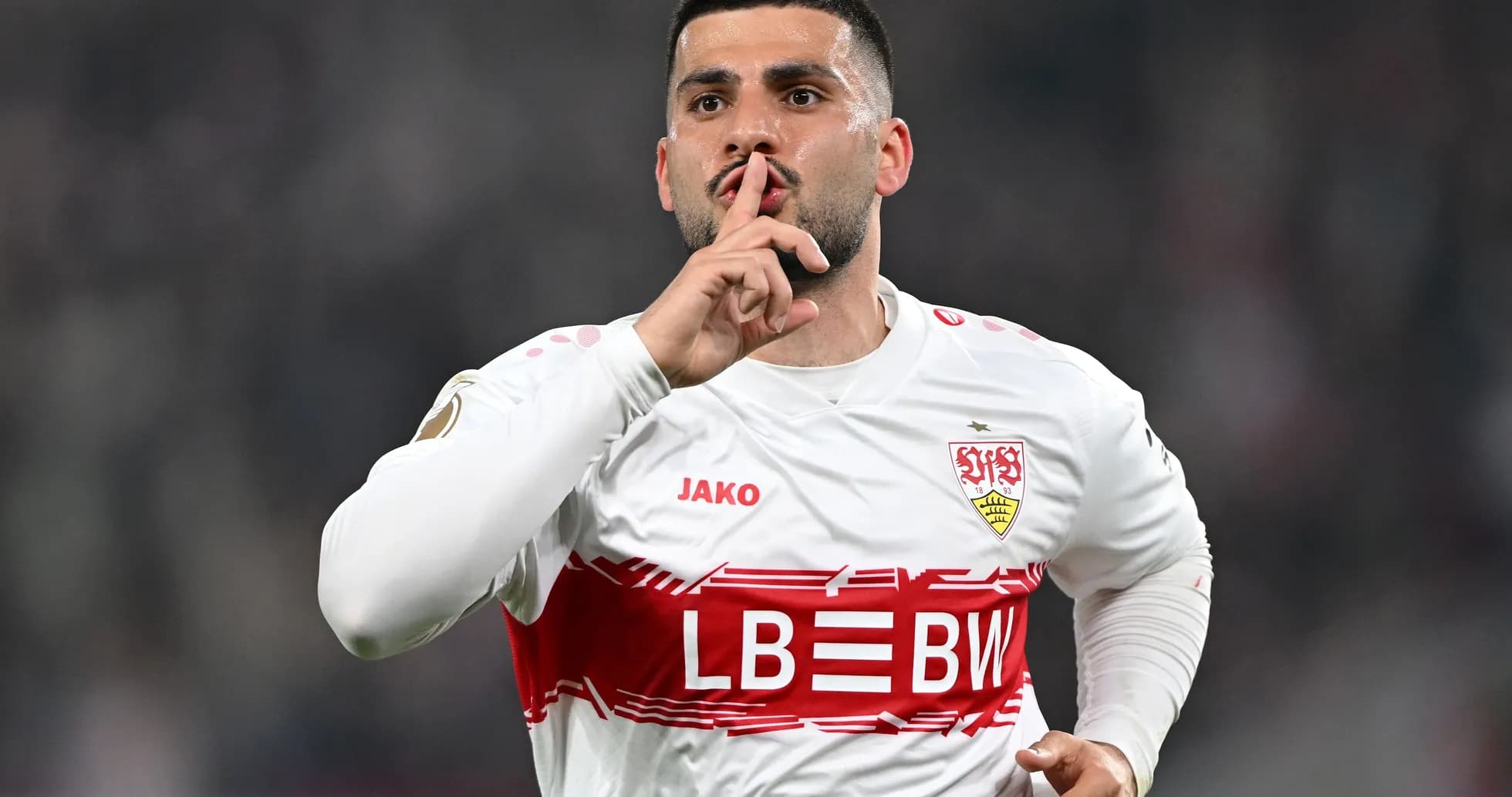 Player celebrating with a shushing gesture after scoring Player celebrating with a shushing gesture after scoring
