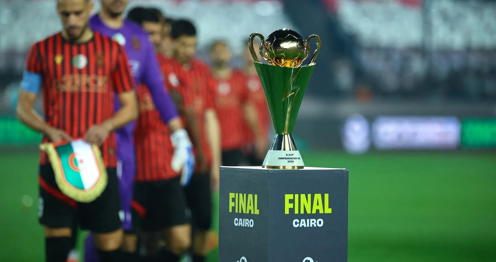 Players walking past the CAF Confederation Cup trophy Players walking past the CAF Confederation Cup trophy
