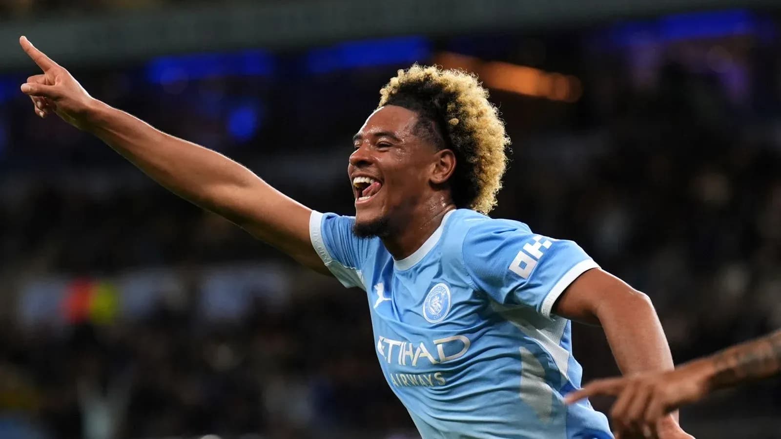Player celebrating a goal during a match Player celebrating a goal during a match