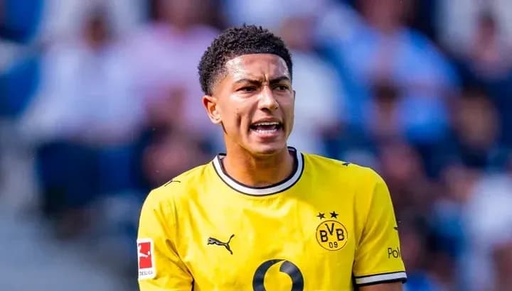 Player in yellow jersey speaking on the field Player in yellow jersey speaking on the field