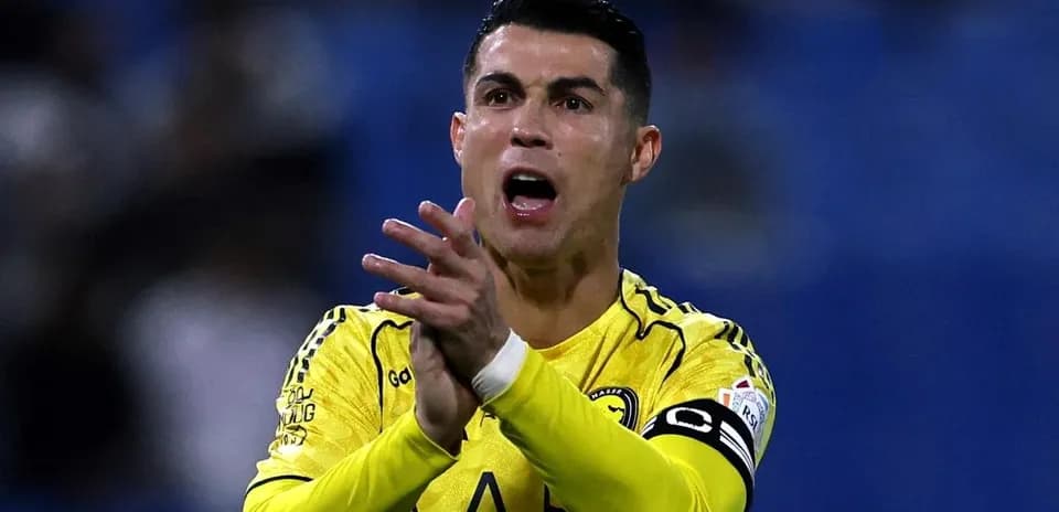 Player in yellow jersey gesturing on the field Player in yellow jersey gesturing on the field