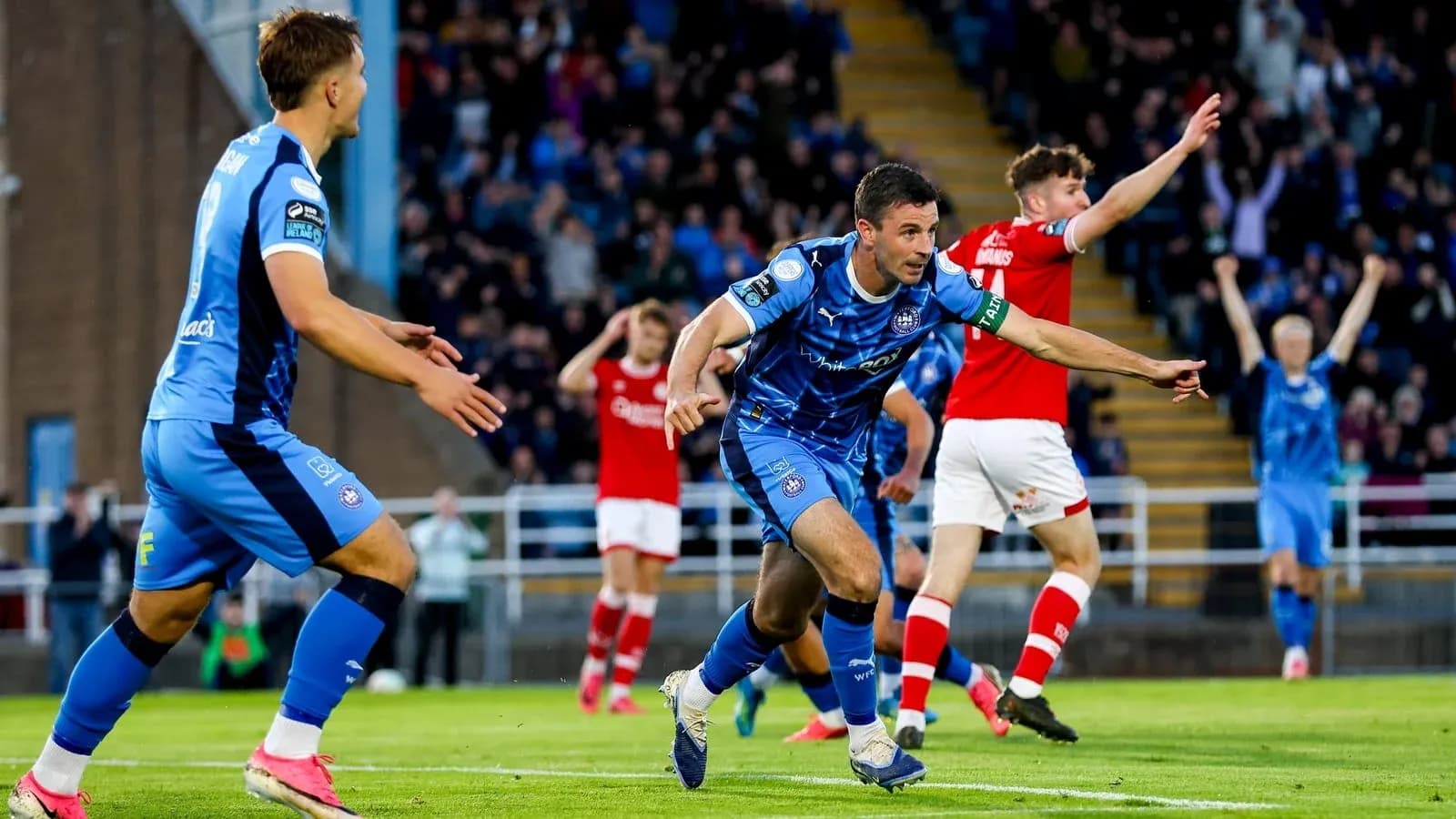Player celebrating a goal in a football match Player celebrating a goal in a football match