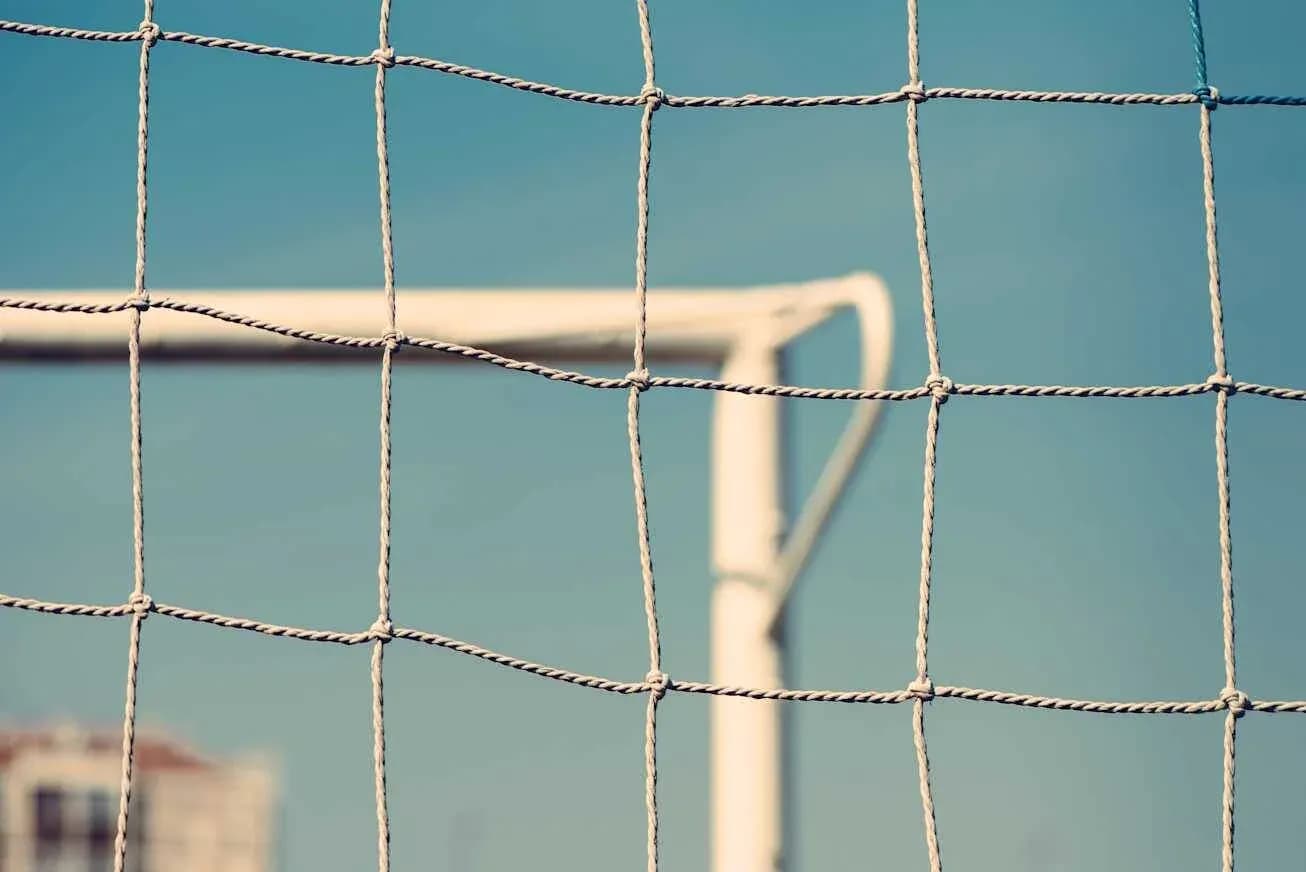 Close-up of a soccer goal net and frame Close-up of a soccer goal net and frame