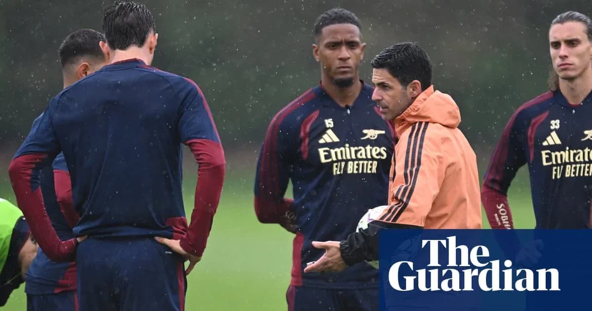 Manager discussing strategy with players during training Manager discussing strategy with players during training