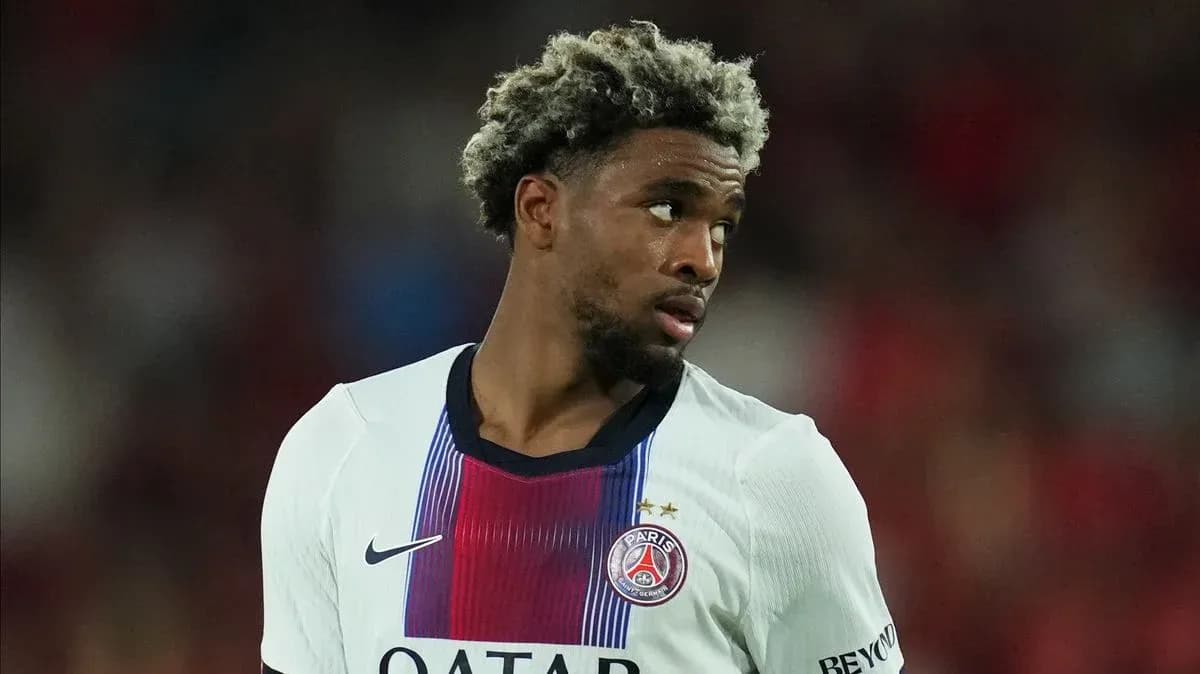 Player in PSG jersey during match action Player in PSG jersey during match action