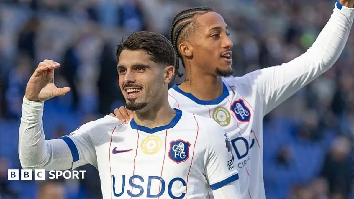 Two Chelsea FC players celebrating on the pitch Two Chelsea FC players celebrating on the pitch