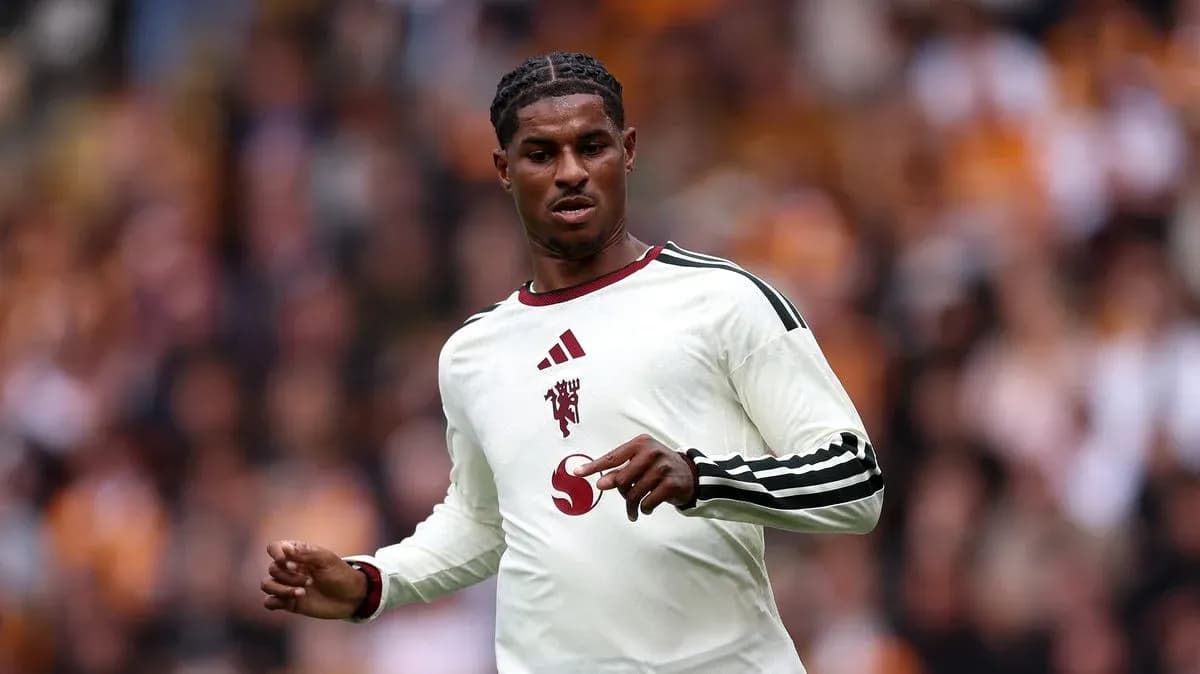 Player in white jersey during football match Player in white jersey during football match