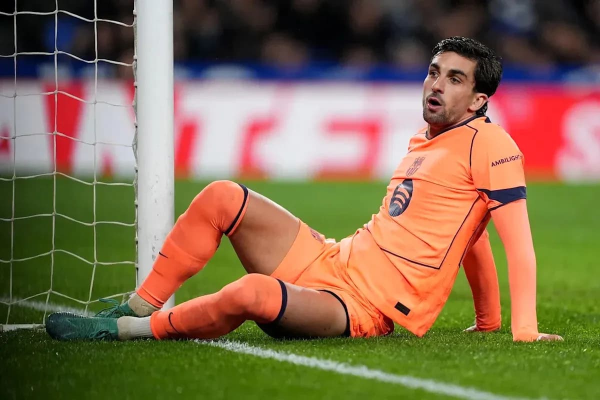 Goalkeeper sitting near goalpost during match Goalkeeper sitting near goalpost during match